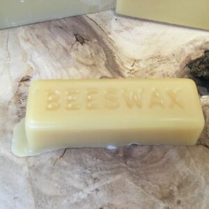 Y.S. Eco Bee Farms USA 2-pound food-grade beeswax block on a white background